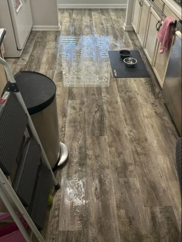 Water on kitchen floor from a toilet overflow