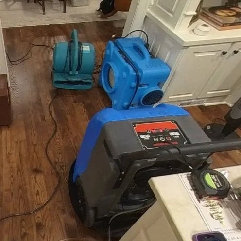 ServiceMaster set drying equipment to save the hardwood floors