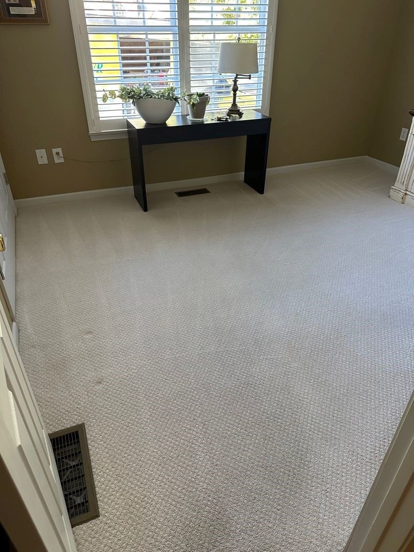 ServiceMaster cleaning truck outside room that just had carpet cleaned