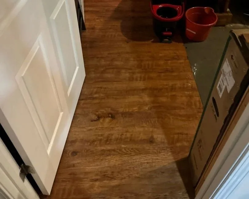Basement utility room floor after water heater burst