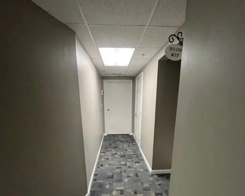 A short hallway carpet after ServiceMaster carpet cleaning was performed