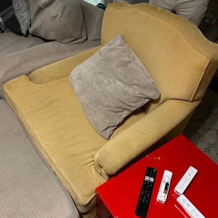 Upholstered chair before ServiceMaster upholstery deep cleaning