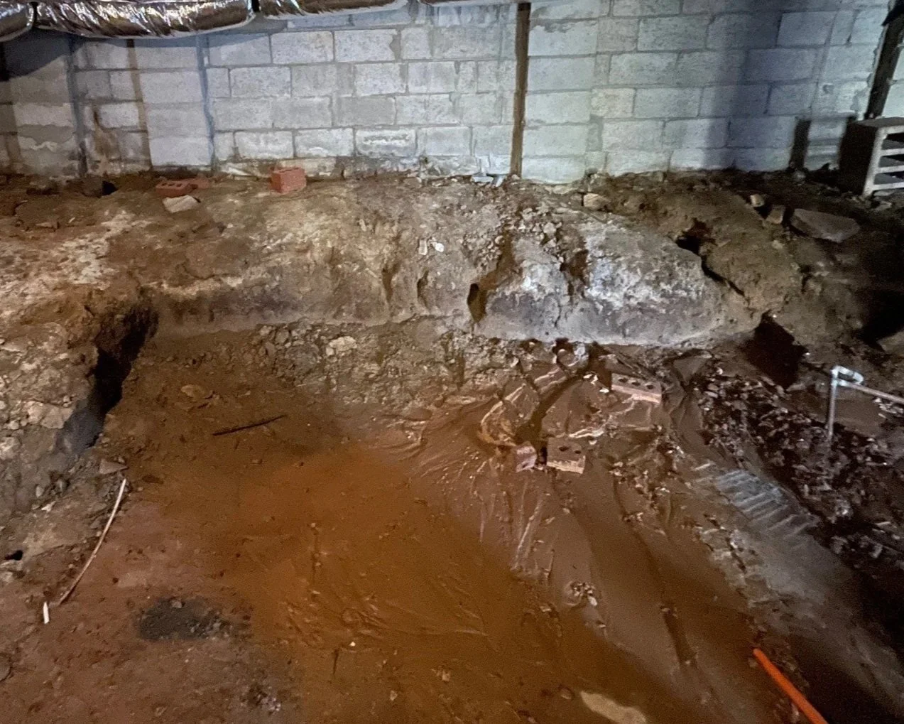 Flooded crawlspace after water main break in the yard
