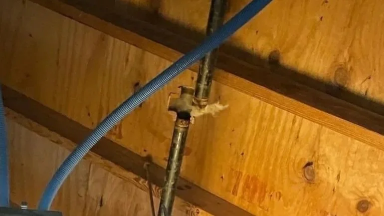 Broken pipe in ceiling after a freeze causing water damage