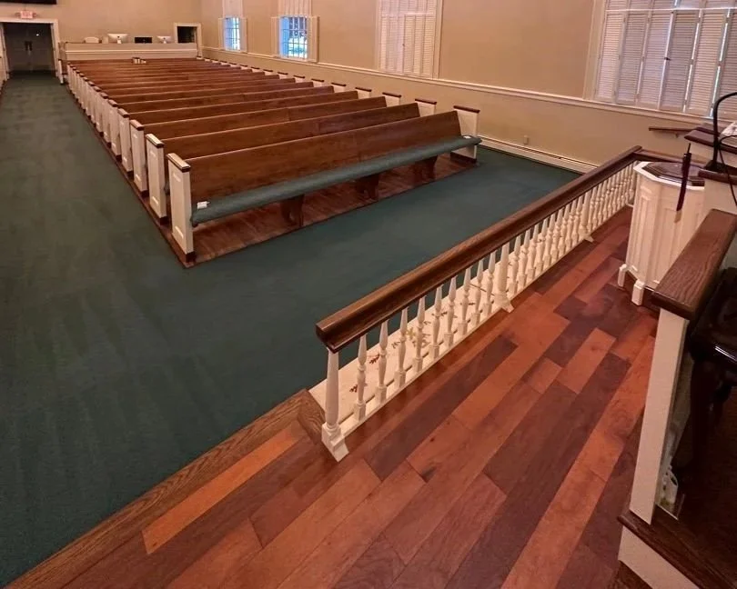 Carpet around the left side pews after a ServiceMaster professional carpet cleaning