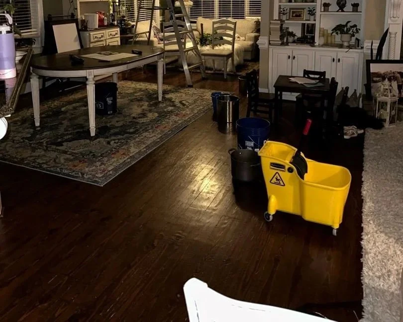 Living room wood floor damaged after a 2nd floor toilet tank cracked