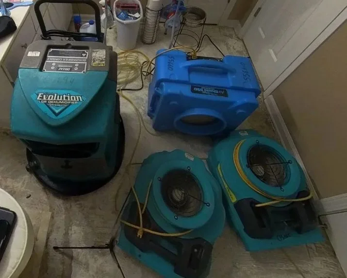 Equipment set by ServiceMaster to dry a bathroom during a water damage mitigation