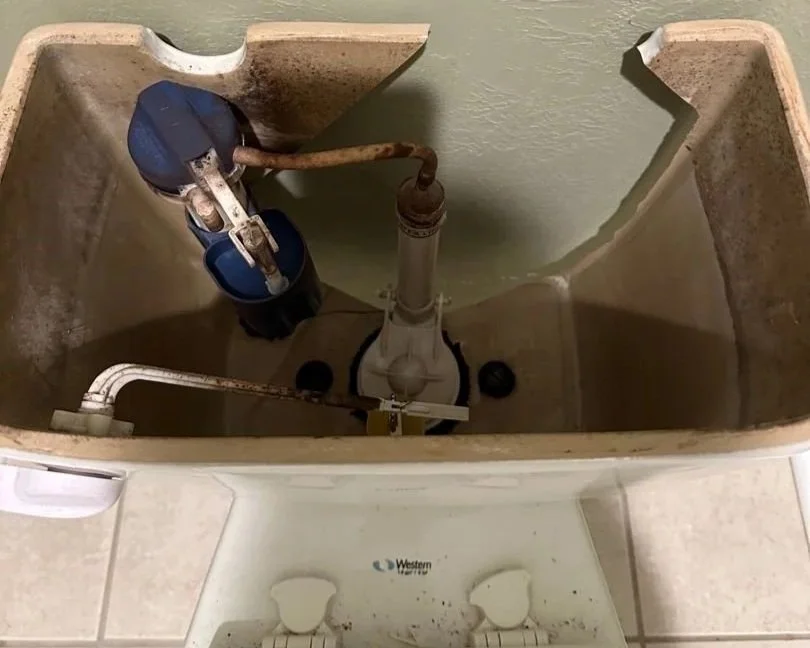 Cracked toilet tank that caused water damage to this home