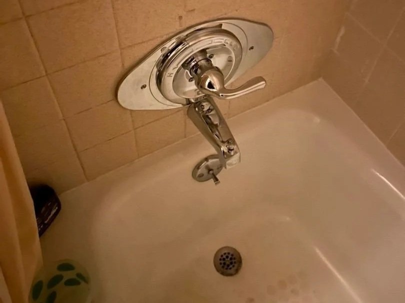 A bathtub faucet leaked causing water damage to the home