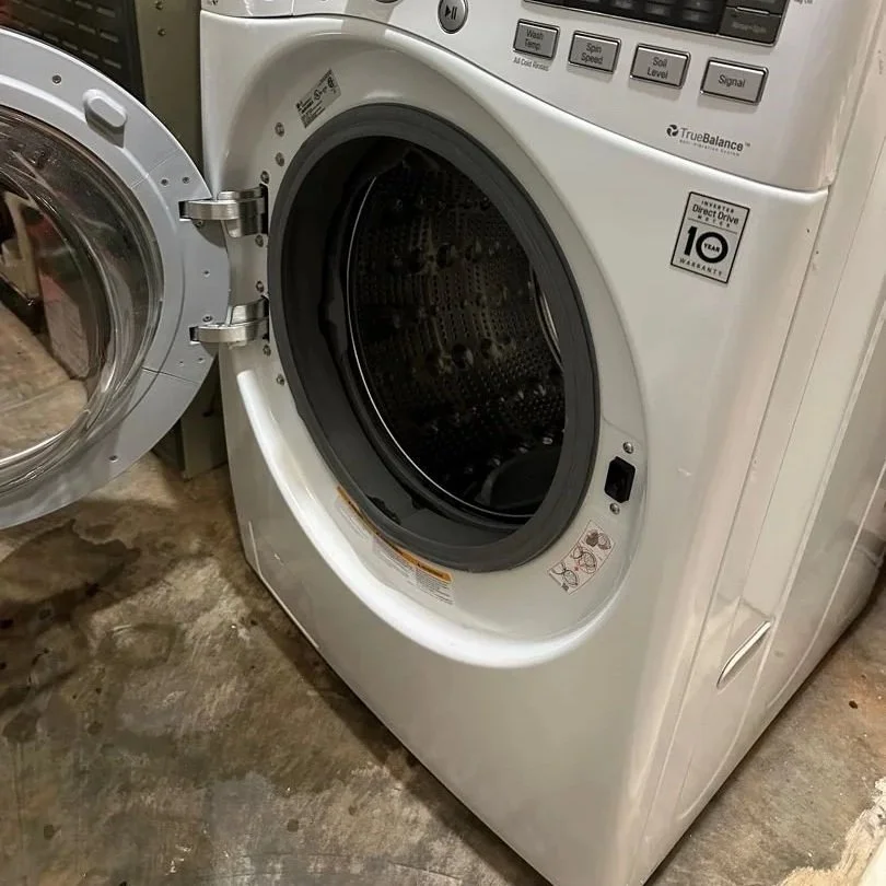Washing machine door opened during a wash cycle causing water damage to the basement