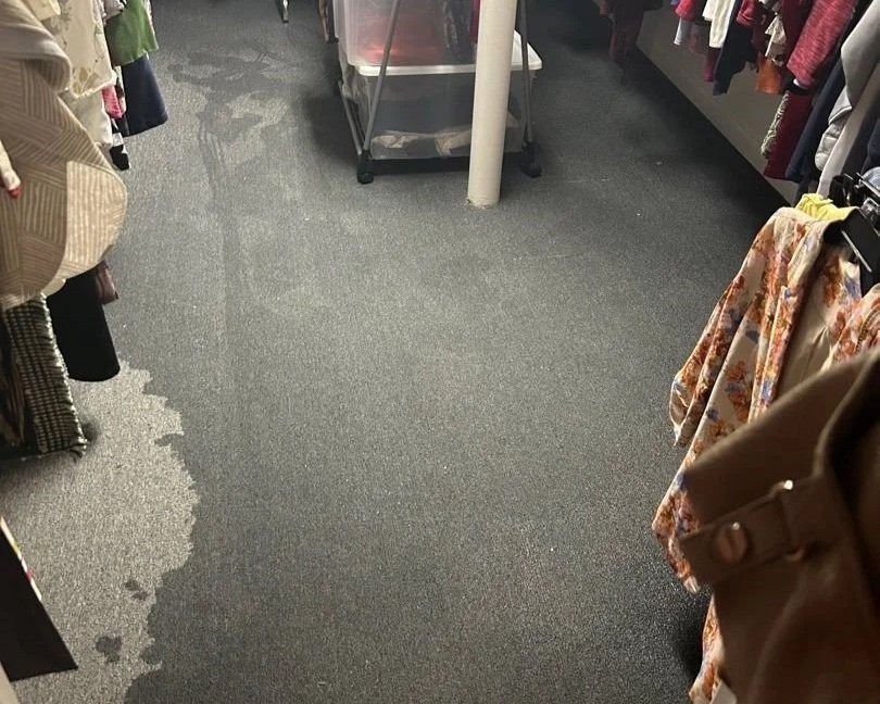 Wet carpet in closet after heavy rain flooded basement
