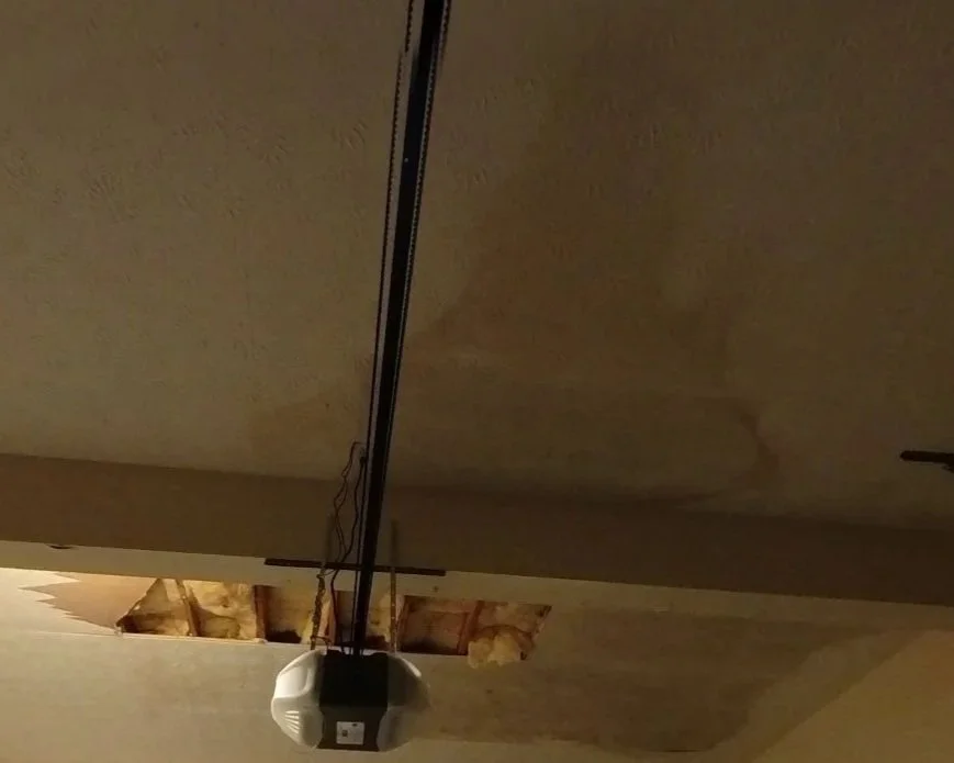 Water damaged ceiling in garage after toilet supply line broke