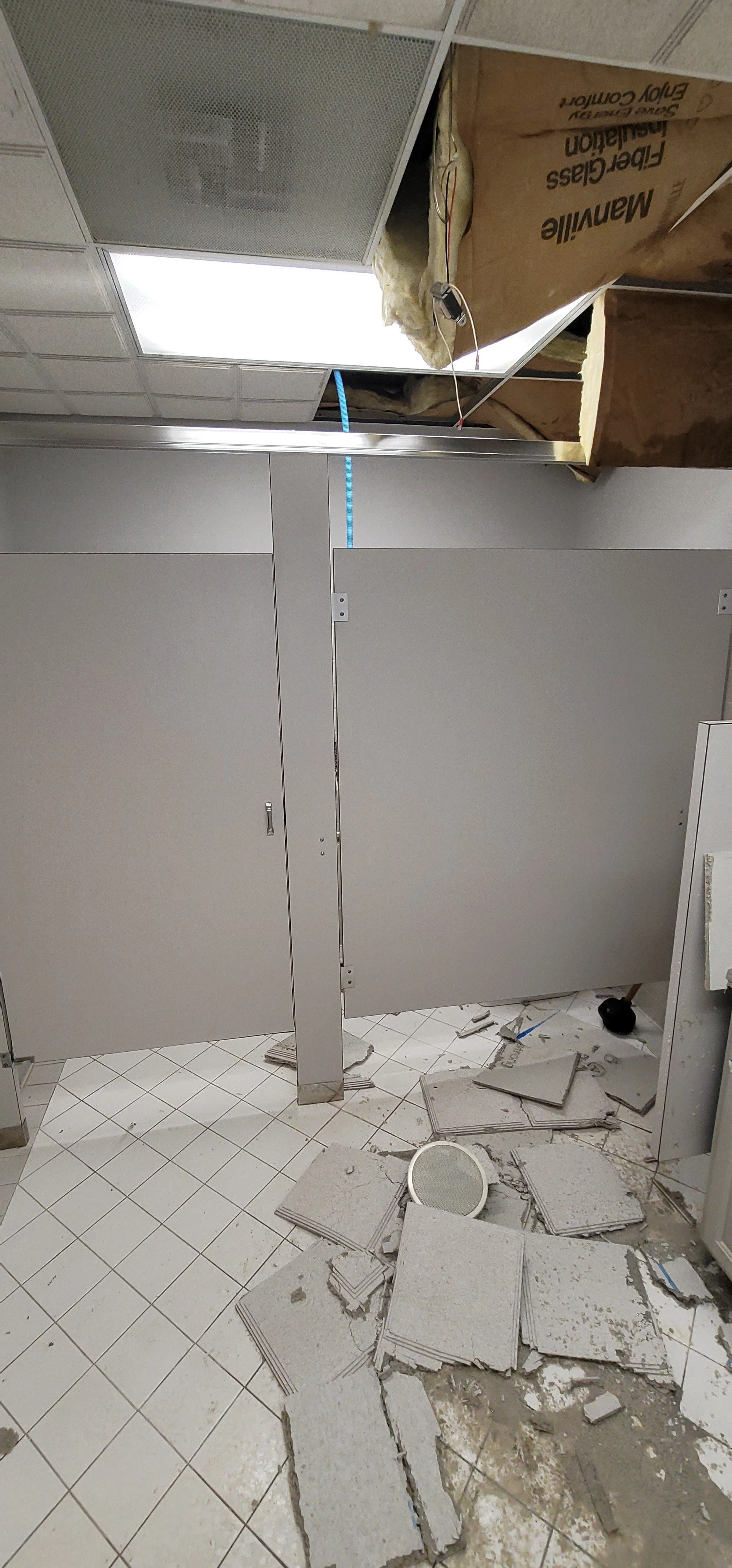 Ceiling fell in a bathroom after water damage from a burst pipe