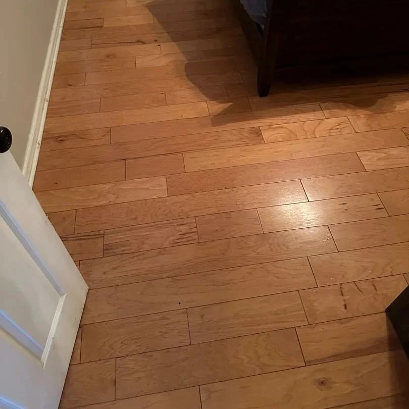 Bedroom hardwood floor before ServiceMaster hardwood floor cleaning