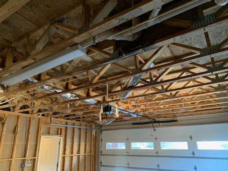 ServiceMaster removed drywall and insulation from the walls and ceiling after a pipe burst during a freeze