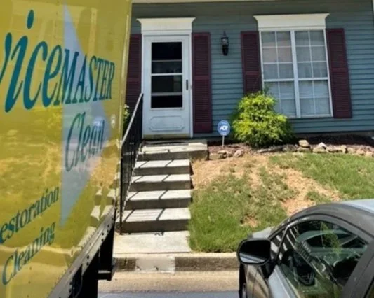 ServiceMaster Clean truck in front of customer's home
