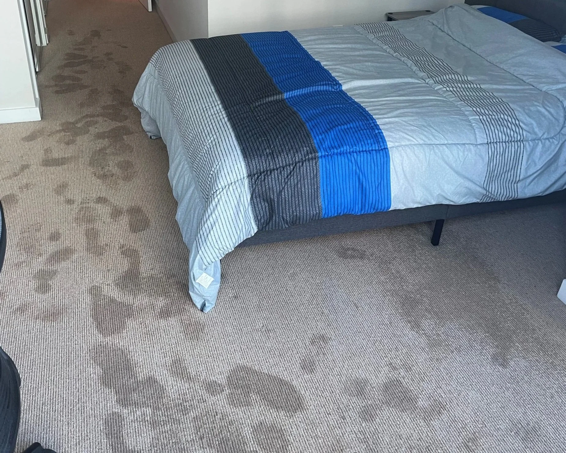 Bedroom floor before ServiceMaster water damage mitigation