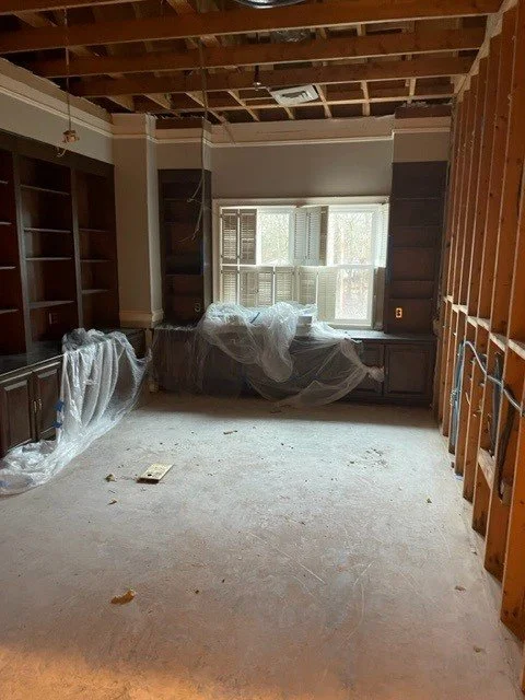 Office after ServiceMaster removed wet drywall and flooring and dried the room