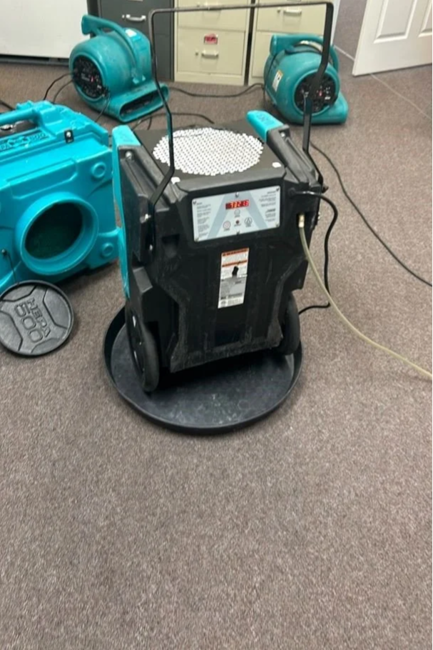 ServiceMaster equipment drying office carpet