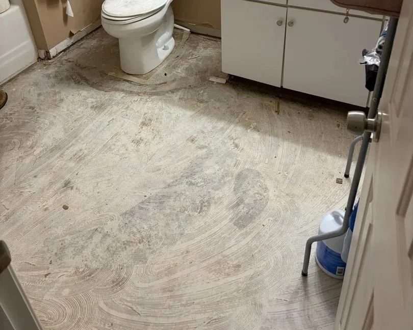 Bathroom floor after ServiceMaster water damage mitigation completed