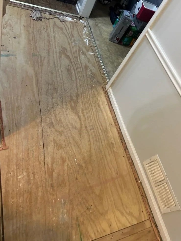 Plywood subfloor in hallway safe and dry after ServiceMaster water damage mitigation completed