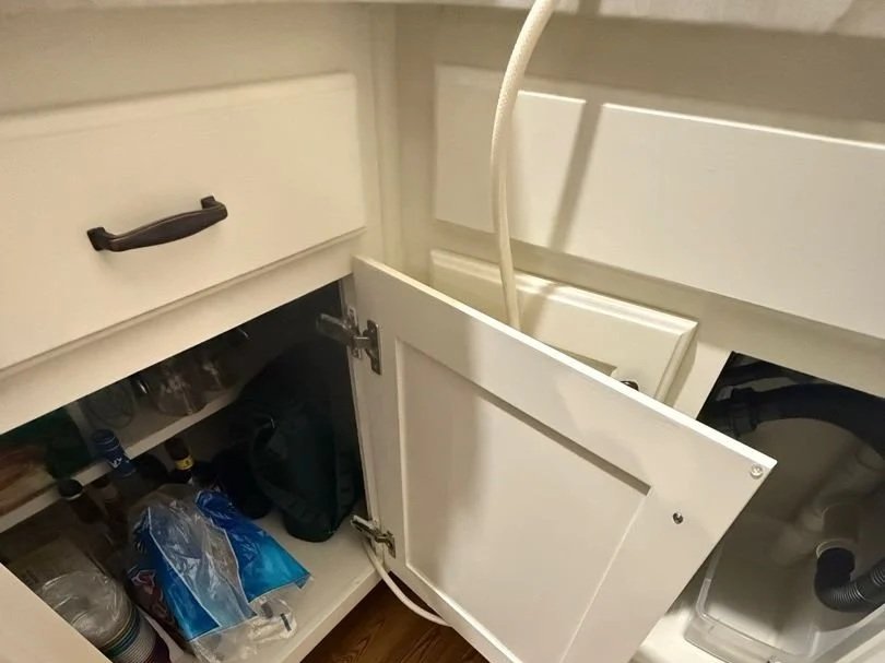 Ice maker supply line run to the sink because it was disconnected but not capped off by plumber