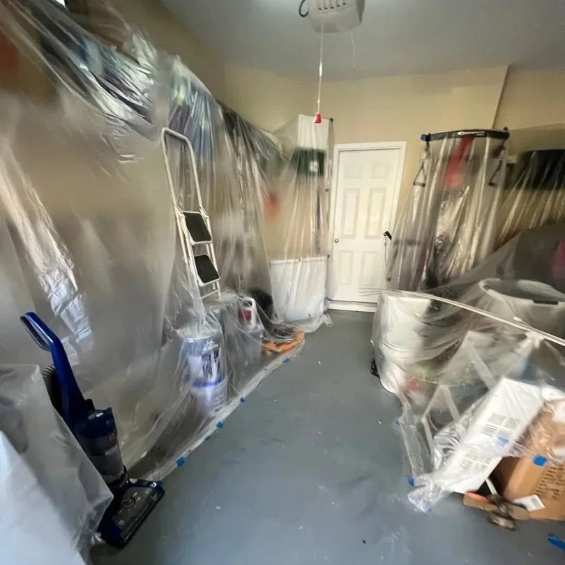 Plastic left in place after ServiceMaster completed mitigation so contents were protected during repairs