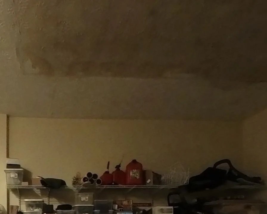 Water damaged ceiling in garage after toilet supply line broke