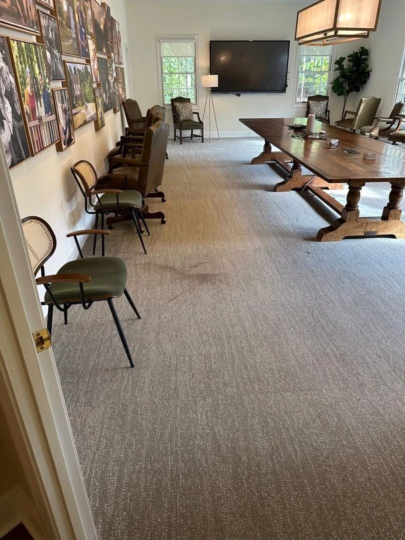 Conference room stain on carpet before ServiceMaster carpet cleaning