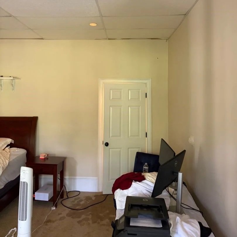 Bedroom basement ceiling and carpet damaged by water