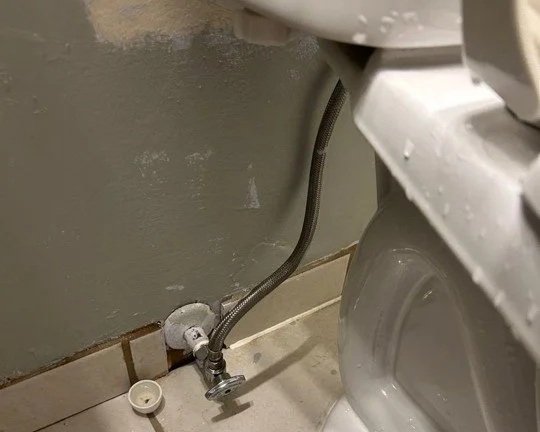 Water on toilet, wall and floor from toilet supply line leak