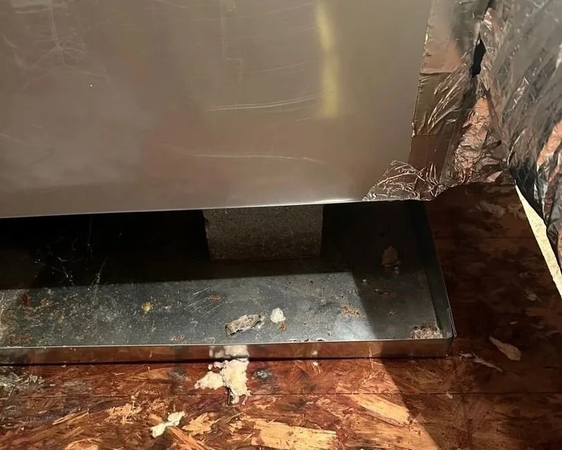 Wet subfloor below leaking attic HVAC unit