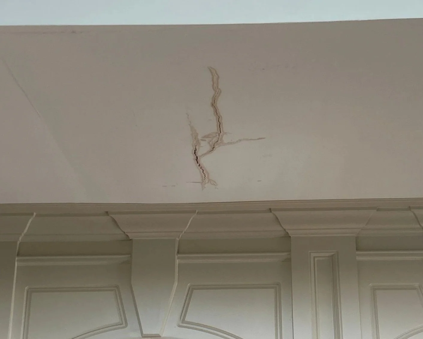Ceiling damage in living room after a bathtub overflowed