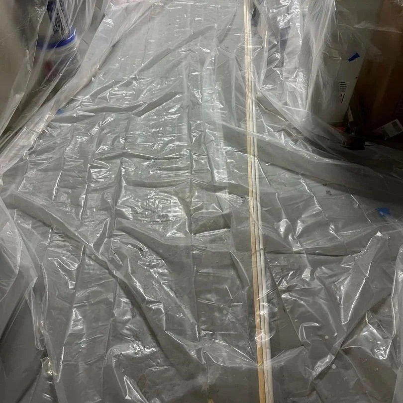 Even floor was covered to catch dust from drywall removal