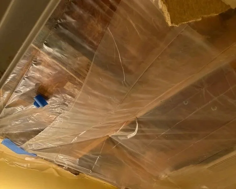 Bathroom affected drywall removed and ceiling cavity contained