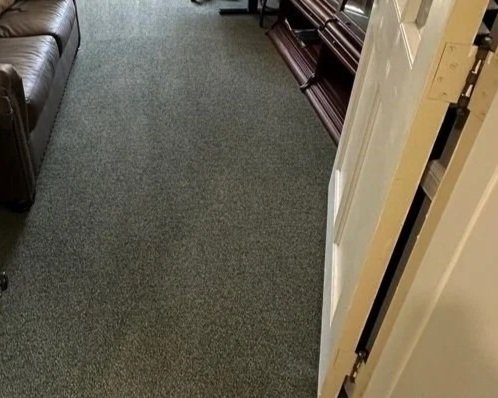 Office carpet with stain removed during ServiceMaster professional carpet cleaning
