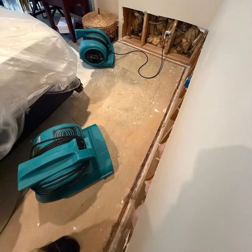 Damaged drywall and carpet removed from basement bedroom