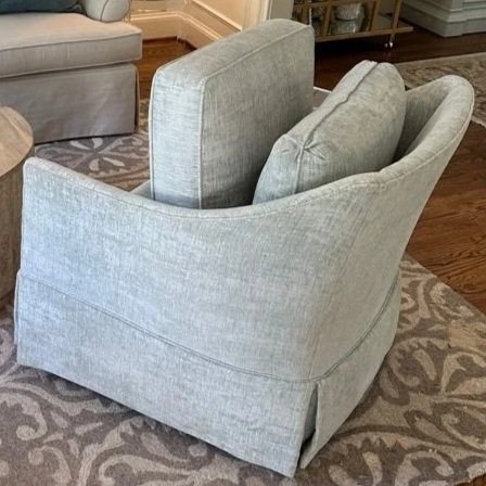 Upholstered chair before ServiceMaster professional deep upholstery cleaning