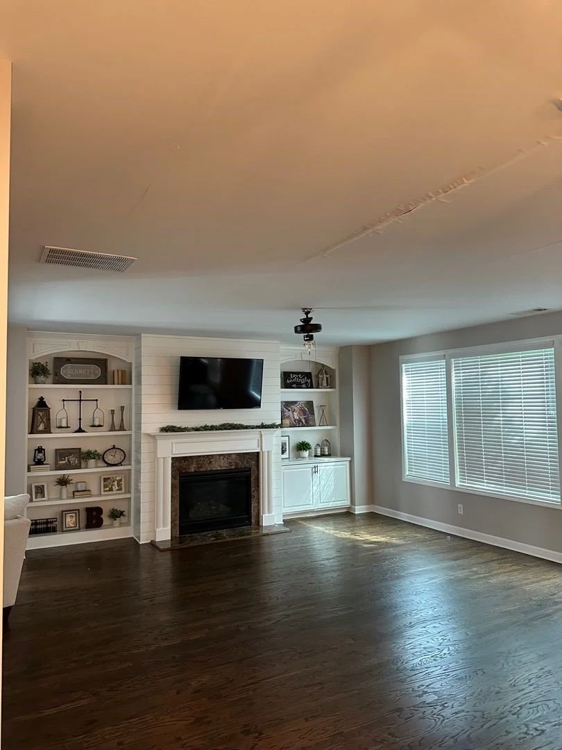 Ceiling damage from bathtub drain leak in bathroom above this living room