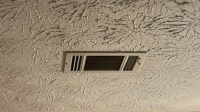 Vent with smoke and soot damage after a space heater fire