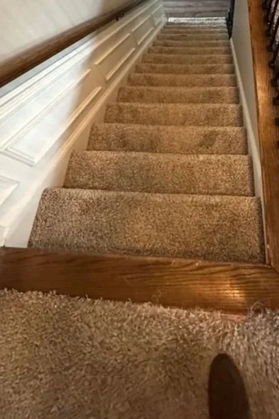 Looking down staircase before ServiceMaster move out carpet cleaning