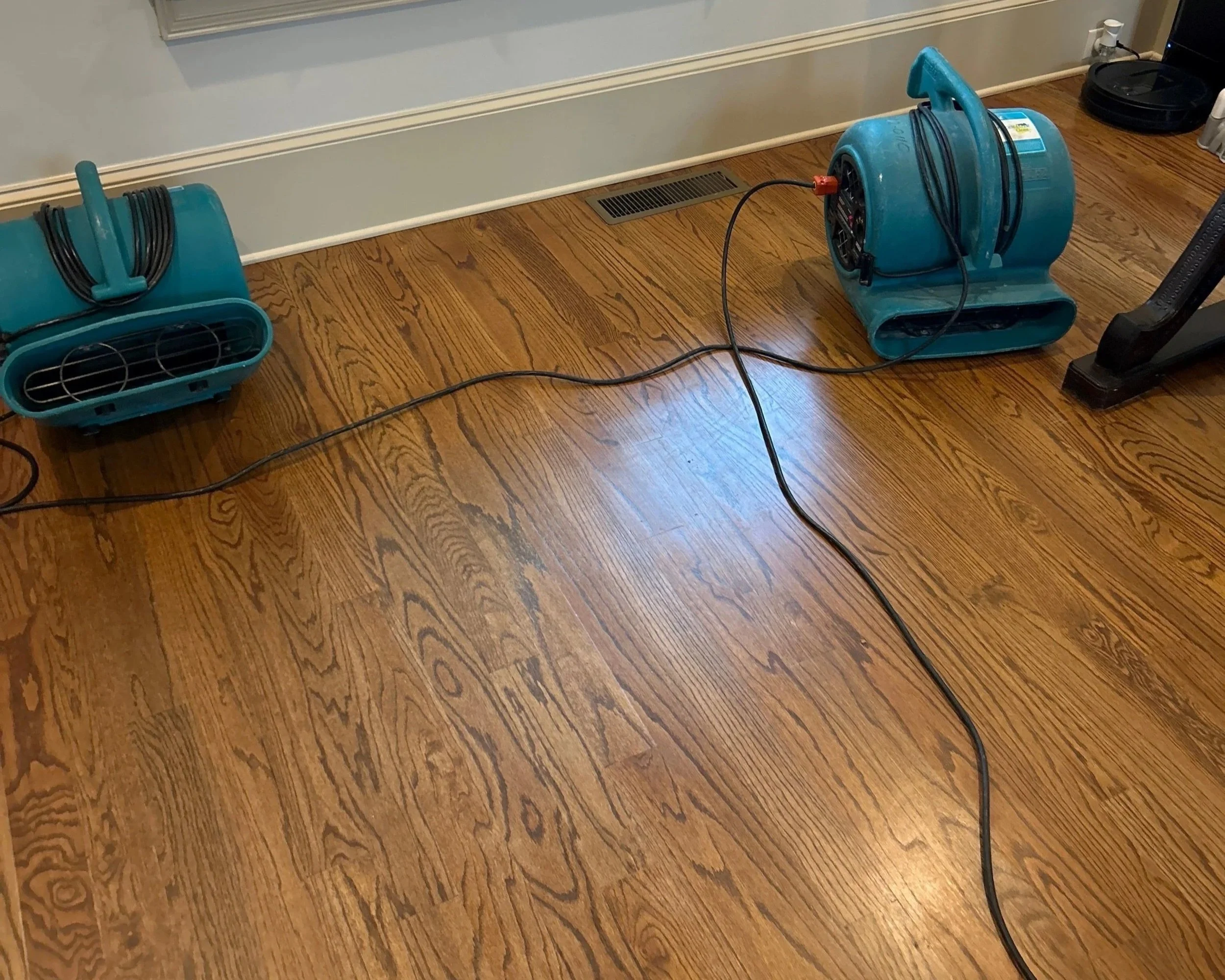 ServiceMaster set air movers to dry floor and ceiling in den after 2nd floor bathtub overflow