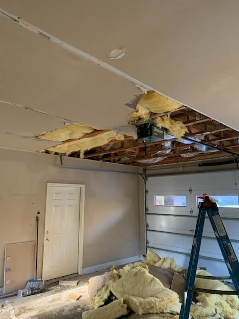 Ceiling drywall and insulation fell caused by water damage from a burst pipe during a freeze