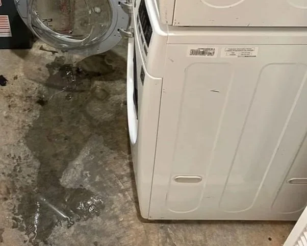 Water on floor after front loading washer door opened during wash cycle