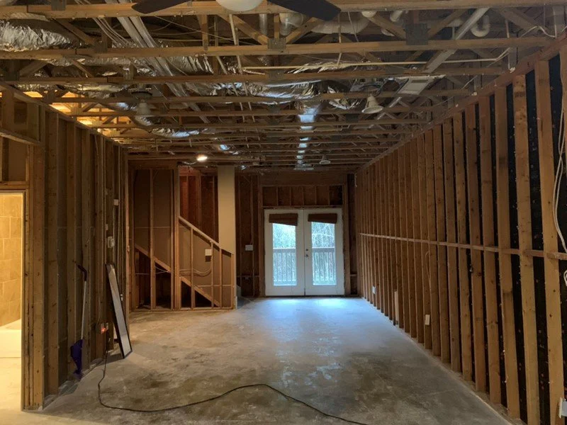 ServiceMaster removed damaged flooring and drywall from walls and ceiling after pipe burst from freeze