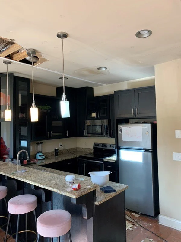 Kitchen ceiling was damaged after a pipe burst during a freeze