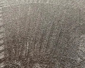 Ground in dirt and stain removed by ServiceMaster in high traffic area during move out carpet cleaning