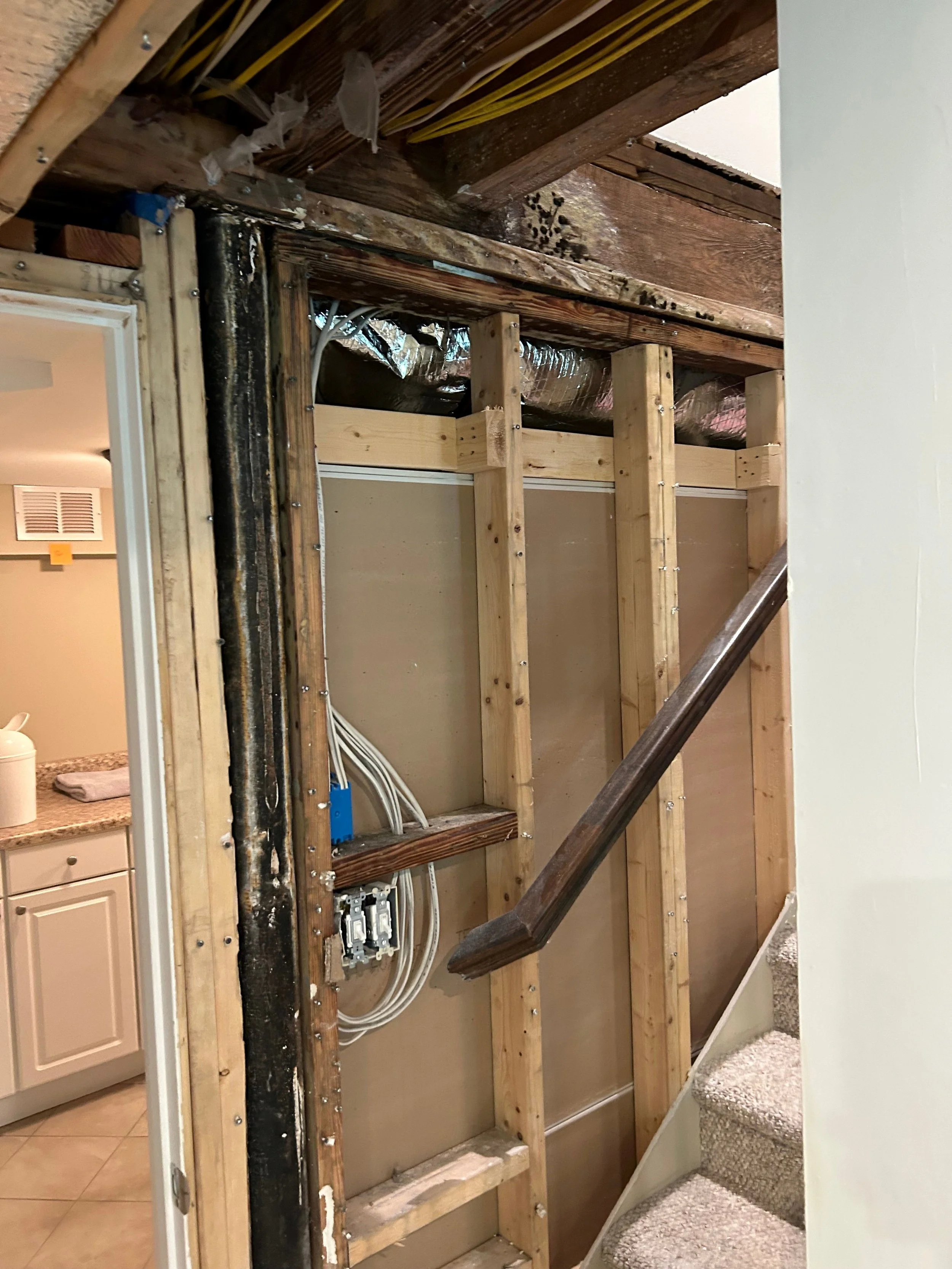 ServiceMaster removed damaged drywall from walls and ceiling in stairwell