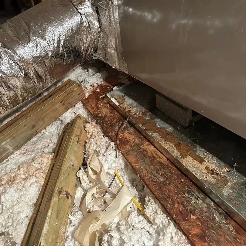 Wet subfloor underneath leaking attic HVAC unit