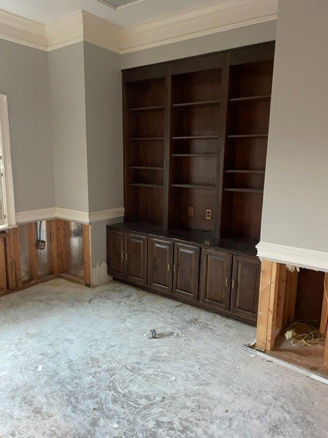 Built in cabinets in executive office after ServiceMaster removed wet flooring and drywall and dried out the room